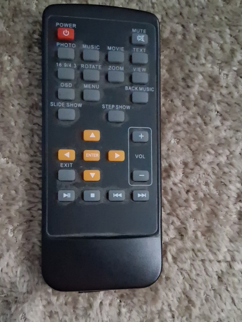 Source Unknown Black Remote with Orange and Gray Buttons